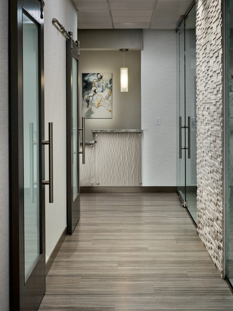 hallway with glass doors on both sides